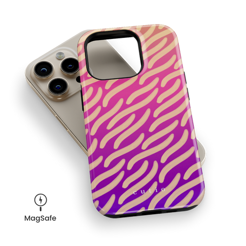 Afterglow MagSafe phone case featuring painterly beige waves stretching over a vivid gradient of orange, pink, and purple, top down view on iPhone