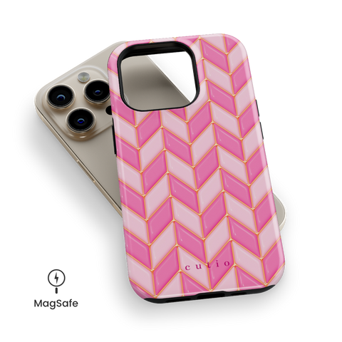 Blush Chevron MagSafe phone case featuring glossy 3D-effect chevron pattern in alternating blush and pink with gold trim details, top down view on iPhone