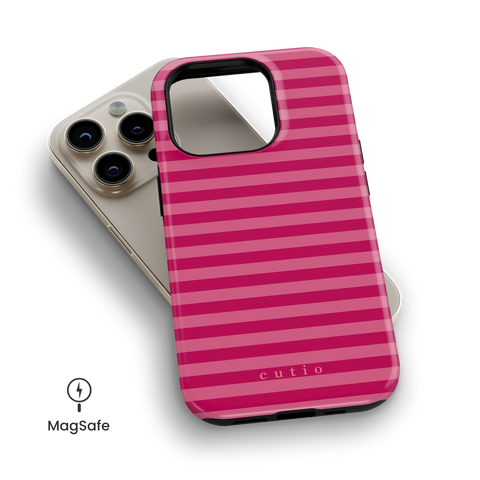 Girls Day MagSafe phone case featuring feminine, bright pink stripes pattern, top down view on iPhone