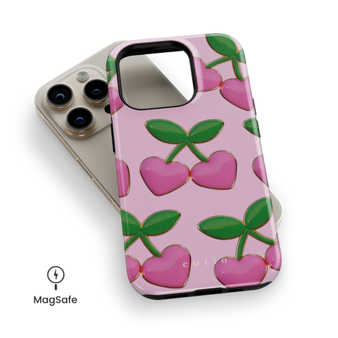Hearted MagSafe phone case featuring adorable 3D-look pink hearts and green leaves with gold details on sweet pink background, top down view on iPhone