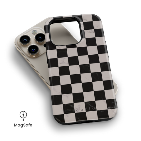 Marble Checkerboard MagSafe phone case featuring bold black and white marble checkerboard pattern, top down view on iPhone