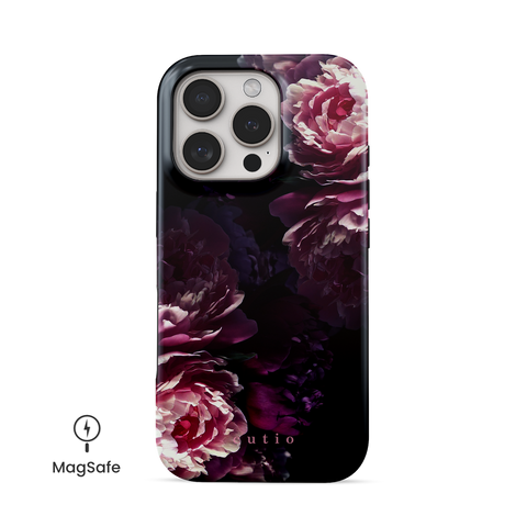 Midnight Blooms MagSafe phone case featuring pink and purple peonies on black background design, front view on iPhone