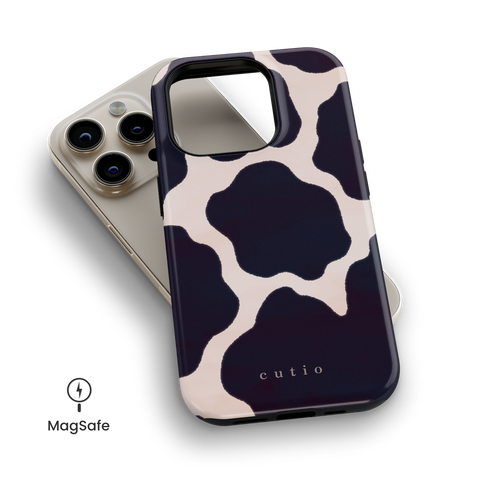 Moo MagSafe phone case featuring chic cow print design, top down view on iPhone