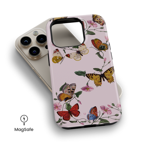 Morning Routine MagSafe phone case featuring charming pattern of colorful butterflies dancing around pink morning glory vines on soft pink background, top down view on iPhone