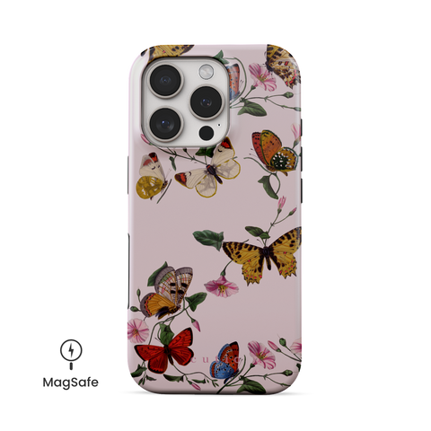 Morning Routine MagSafe phone case featuring charming pattern of colorful butterflies dancing around pink morning glory vines on soft pink background, front view on iPhone