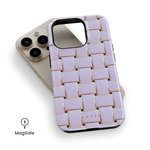 Posh White MagSafe phone case featuring elegant crisscross pattern in glossy white with gold trim details, top down view on iPhone