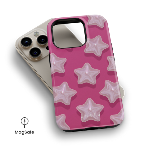 Sophie MagSafe phone case featuring star-shaped pearls on magenta pink background design, top down view on iPhone