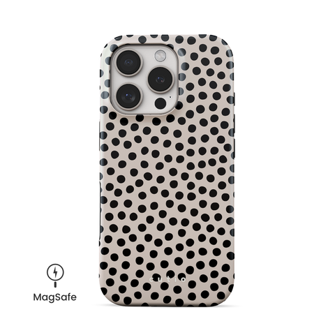 Spotted MagSafe phone case featuring classic organic-shaped polka dots on beige background, front view on iPhone