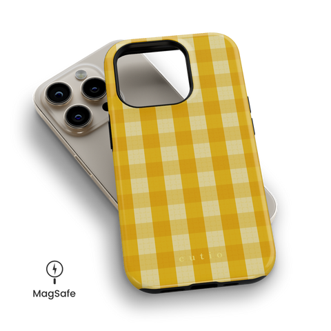 Sundress MagSafe phone case featuring vibrant check pattern in bright yellow tones, top down view on iPhone