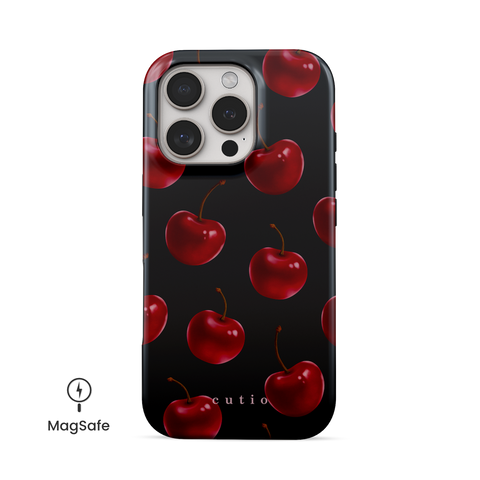 Temptation MagSafe phone case featuring luscious red cherries on black background, front view on iPhone