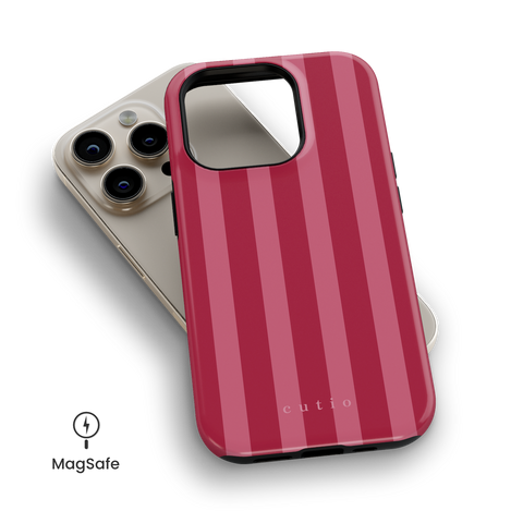 Watermelon MagSafe phone case featuring lovely vertical stripes pattern in rich red and pink tones, top down view on iPhone