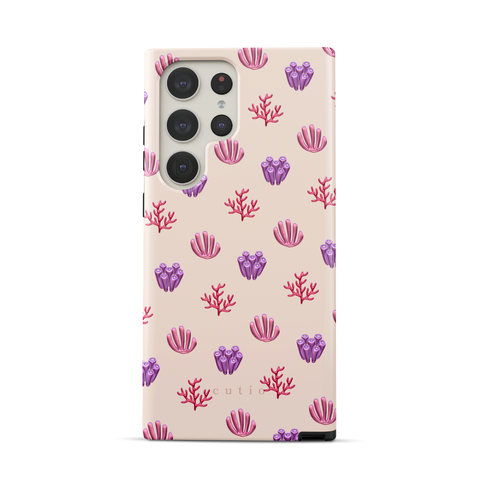 Blooming Coral tough phone case featuring glossy red, pink, and purple coral motifs scattered over a pale blush background, front view on Samsung Galaxy phone
