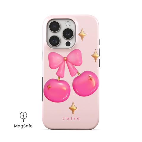 Cherry Pop MagSafe phone case featuring glossy 3D-style hot pink cherries adorned with gold sparkles, tied together by a cute pink bow, front view on iPhone