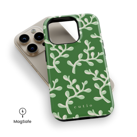 Come Spring MagSafe phone case featuring refreshing abstract leaves pattern on a mossy green background, top down view on iPhone