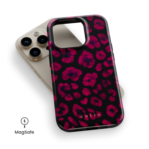 Instinct - Ruby MagSafe phone case featuring abstract ruby red leopard print on a black background, top down view on iPhone
