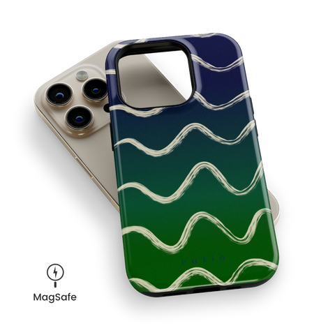 Night Swim MagSafe phone case featuring flowy beige lines sweeping over a moody gradient from navy blue to deep green, top down view on iPhone