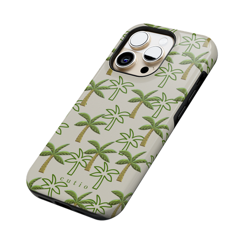 Palm Grove tough phone case featuring pattern of green palm trees on a warm beige background, side view on iPhone