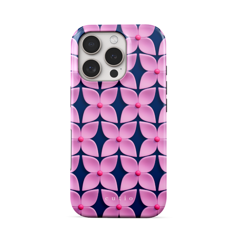 Pink Hydrangea tough phone case featuring abstract glossy pink hydrangea flower pattern with hot pink centers on a deep navy blue background, front view on iPhone
