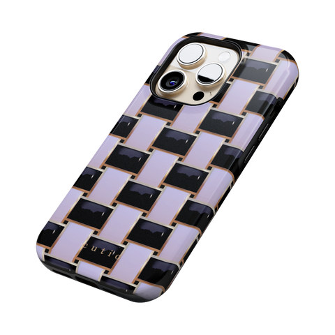 Posh Checker tough phone case featuring elegant crisscross pattern in glossy black and white with gold trim details, side view on iPhone