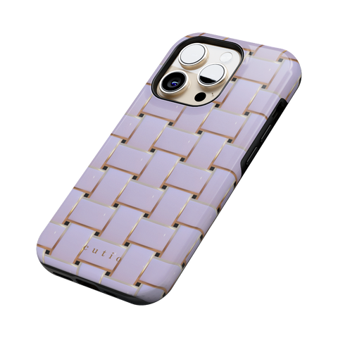 Posh White tough phone case featuring elegant crisscross pattern in glossy white with gold trim details, side view on iPhone