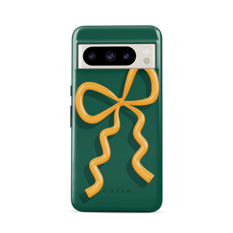 Present Moment - Green tough phone case featuring a glossy orange bow design on a rich green background, resembling a gift wrap ribbon, front view on Google Pixel phone