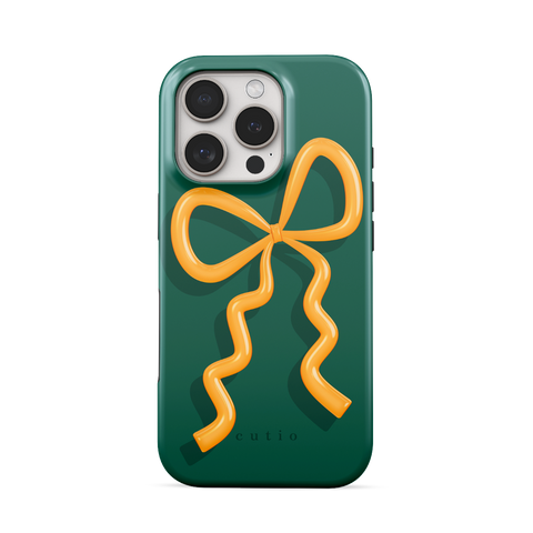 Present Moment - Green tough phone case featuring a glossy orange bow design on a rich green background, resembling a gift wrap ribbon, front view on iPhone