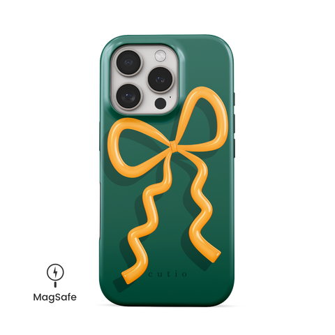 Present Moment - Green MagSafe phone case featuring a glossy orange bow design on a rich green background, resembling a gift wrap ribbon, front view on iPhone