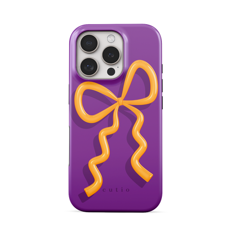 Present Moment - Purple tough phone case featuring a glossy orange bow design on a rich purple background, resembling a gift wrap ribbon, front view on iPhone