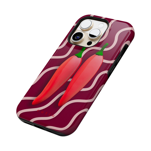 Red Hot Chillies tough phone case featuring bold red chillies on a burgundy background, side view on iPhone