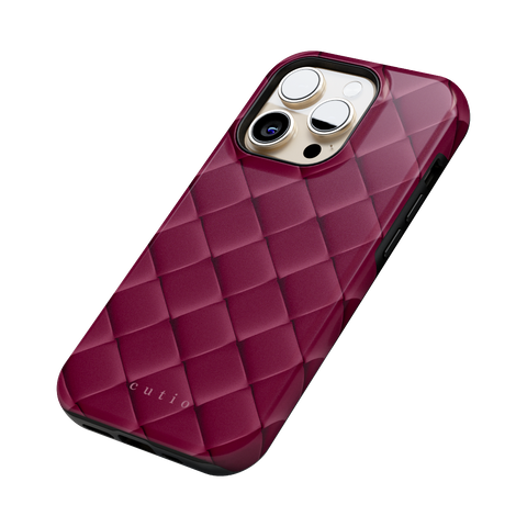 Satin Mulberry tough phone case featuring sleek crisscross pattern in deep satin mulberry, side view on iPhone