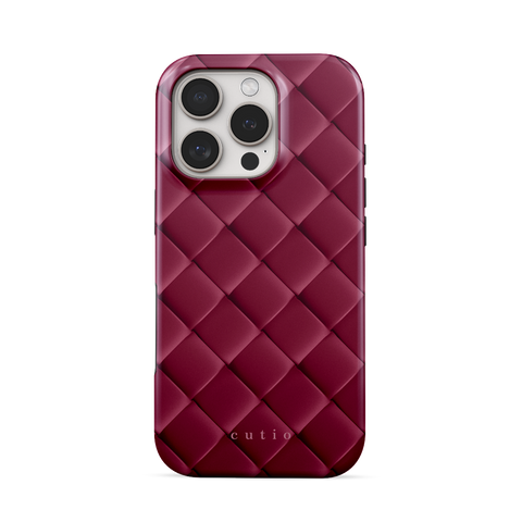 Satin Mulberry tough phone case featuring sleek crisscross pattern in deep satin mulberry, front view on iPhone