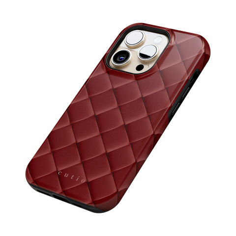 Satin Sienna tough phone case featuring sleek crisscross pattern in dark satin sienna brown, side view on iPhone