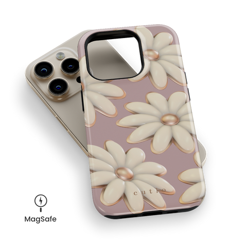Tender MagSafe phone case featuring delicate 3D white daisies on a soft mauve background, top down view on iPhone
