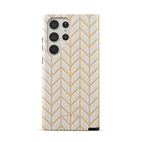 White Chevron tough phone case featuring 3D-effect glossy white chevron pattern with gold trim details, front view on Samsung Galaxy phone