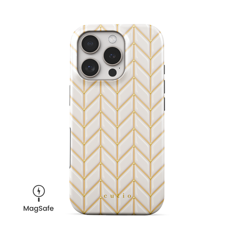White Chevron MagSafe phone case featuring 3D-effect glossy white chevron pattern with gold trim details, front view on iPhone