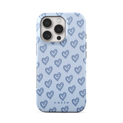 With Love - Dusty Blue tough phone case featuring small hand-drawn heart pattern on a soft dusty blue background, front view on iPhone