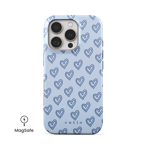 With Love - Dusty Blue MagSafe phone case featuring small hand-drawn heart pattern on a soft dusty blue background, front view on iPhone