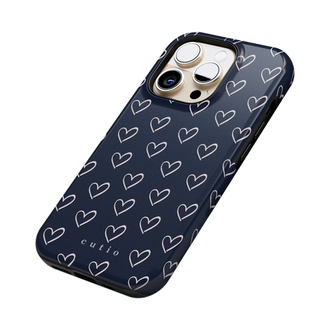 With Love - Navy Blue tough phone case featuring small hand-drawn heart pattern in off-white on a deep navy blue background, side view on iPhone