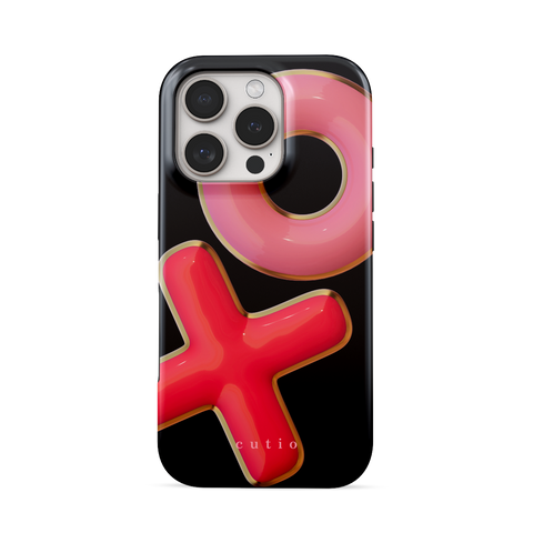 XO tough phone case featuring 3D-effect XO design in bright red and pink with gold trim accents on a black background, front view on iPhone