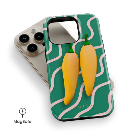 Yellow Sweet Chillies MagSafe phone case featuring playful yellow chillies on a green abstract background, top down view on iPhone